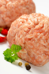 two raw meatballs