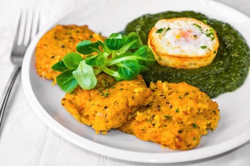 Pumpkin pancake with spinach and fried egg