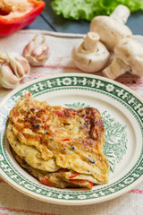 Rustic omelette with mushrooms and pepper
