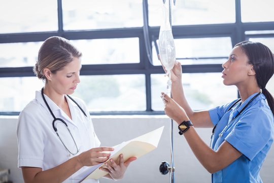 Medical Team Preparing An IV Drip