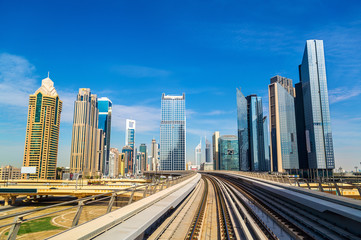 Fototapeta na wymiar Skyscrapers and metro in Dubai - UAE