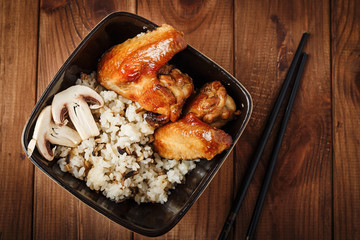 Rice with mushrooms and baked chicken wings
