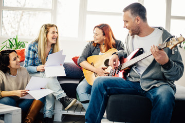 Home band learning new song together