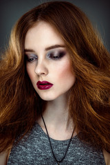 Fototapeta premium Close up portrait of beautiful woman with fashion hairstyle and bright make up