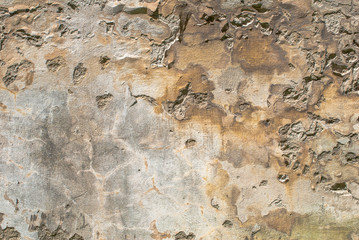 old chipped plaster on the concrete wall texture background