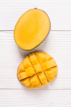 Fresh rip mango on a wooden background.Healthy food