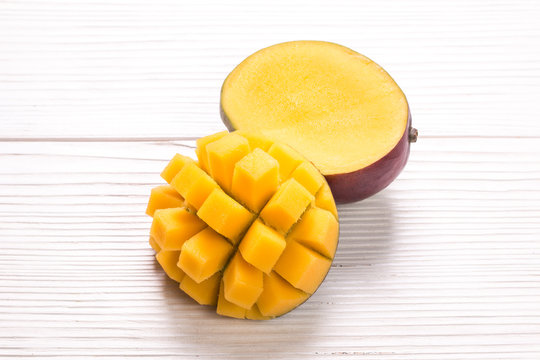 Fresh rip mango on a wooden background.Healthy food