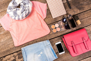 Women's casual clothes on wooden background