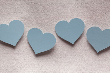 Four blue paper hearts