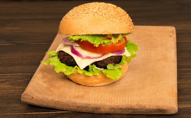 Gourmet Tasty Steak Burgers on a Wooden Tray. wooden background.