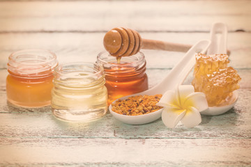 healthy honey composition, wooden background, vintage filters