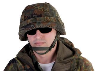 Portrait of a soldier wearing dark glasses (isolated on white)