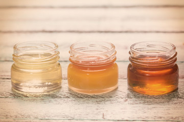 healthy honey composition, wooden background, vintage filters