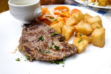 juicy steak beef meat with tomato and french fries
