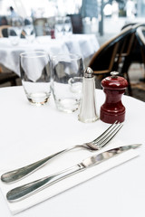 table setting - plate, knife and fork on table
