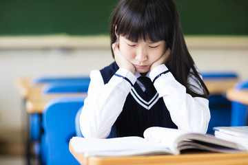 Stressed Student Of High School Sitting in classroom © Tom Wang