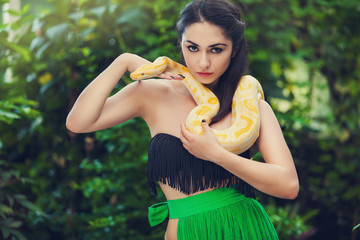 sexy woman holding python