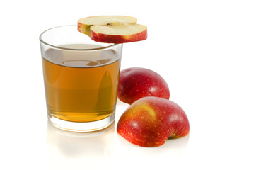 glass of apple juice with a slice of apple
