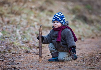 Little boy playing outdoor near lake