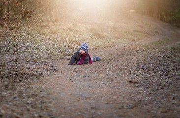 Little boy playing outdoor near forest