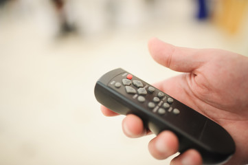 hand holding a remote control