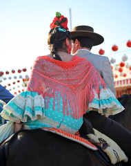 Fototapeta premium Pareja a caballo en la feria, Andalucía, España