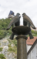 Four dove fountain closeup on Schlossbergplatz in Graz, Austria.