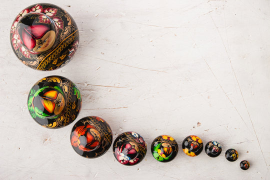 Matreshka set on the white wooden table  top view