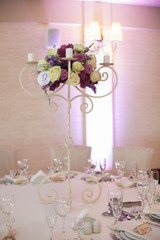 Beautiful floral centerpiece at wedding reception table closeup