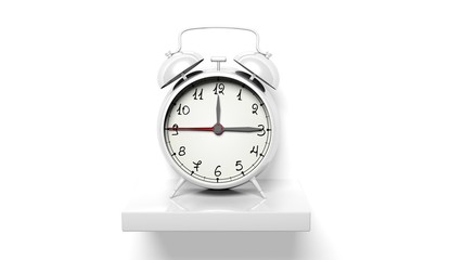 Retro silver alarm clock on white wall shelf