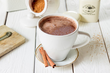 Hot Chocolate Dring with Cinnamon on Light White Wooden Background, Horizontal