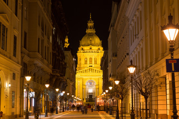 Fototapeta na wymiar Nightshot on Budapest city streets with buildings and lights.