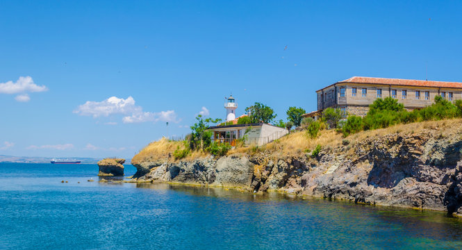 small island of saint anastasia is a new tourist attraction in bulgaria near burgas. reconstructed museum, hotel, restaurant and lighthouse are accompanied by small cute beach.