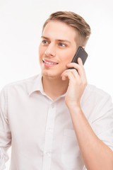 portrait of pretty young businessman talking on his smartphone