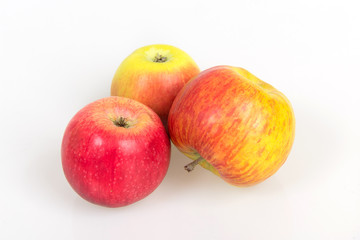 Fototapeta na wymiar Ripe juicy apples on a white background, harvest from the garden, apple diet to slim figure, vitamin dessert