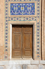 old wooden door with mosaic in the Central Asian style