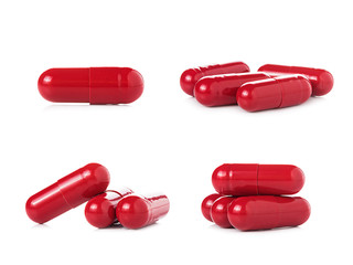 red pill capsules on white background