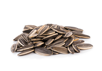 sunflower seeds pile against white background