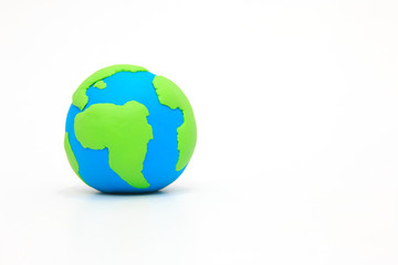 Globe ,earth made from clay on white background with copy space. Concept Save green planet.