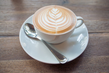 Cup of coffee on wooden table
