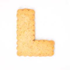 letter L made of cracker cookie isolated on white background.