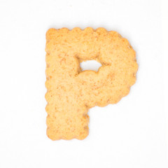 letter P made of cracker cookie isolated on white background.