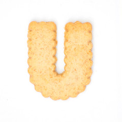 letter U made of cracker cookie isolated on white background.