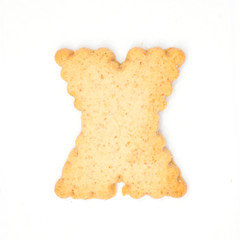 letter X made of cracker cookie isolated on white background.