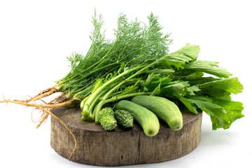 Fresh vegetables on the wooden table isolated on white background