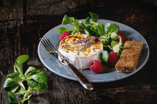 Baked Goat cheese with honey and raspberries