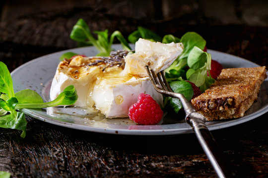 Baked Goat cheese with honey and raspberries