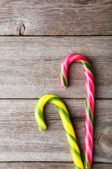 Candies on grey wooden background