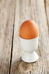 Boiled egg on a grey wooden table