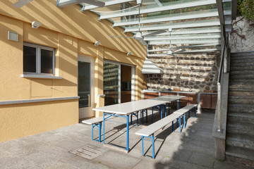 veranda with table and benchs